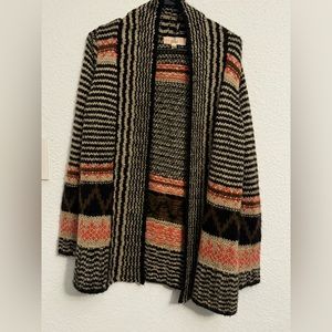 Lightly worn sweater with nice colors. Heavy enough for winter!